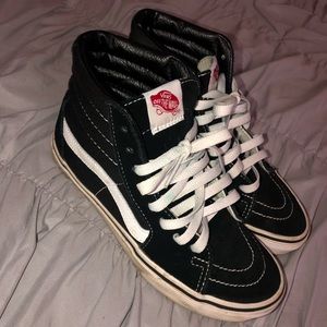 black and white sk8-hi vans.